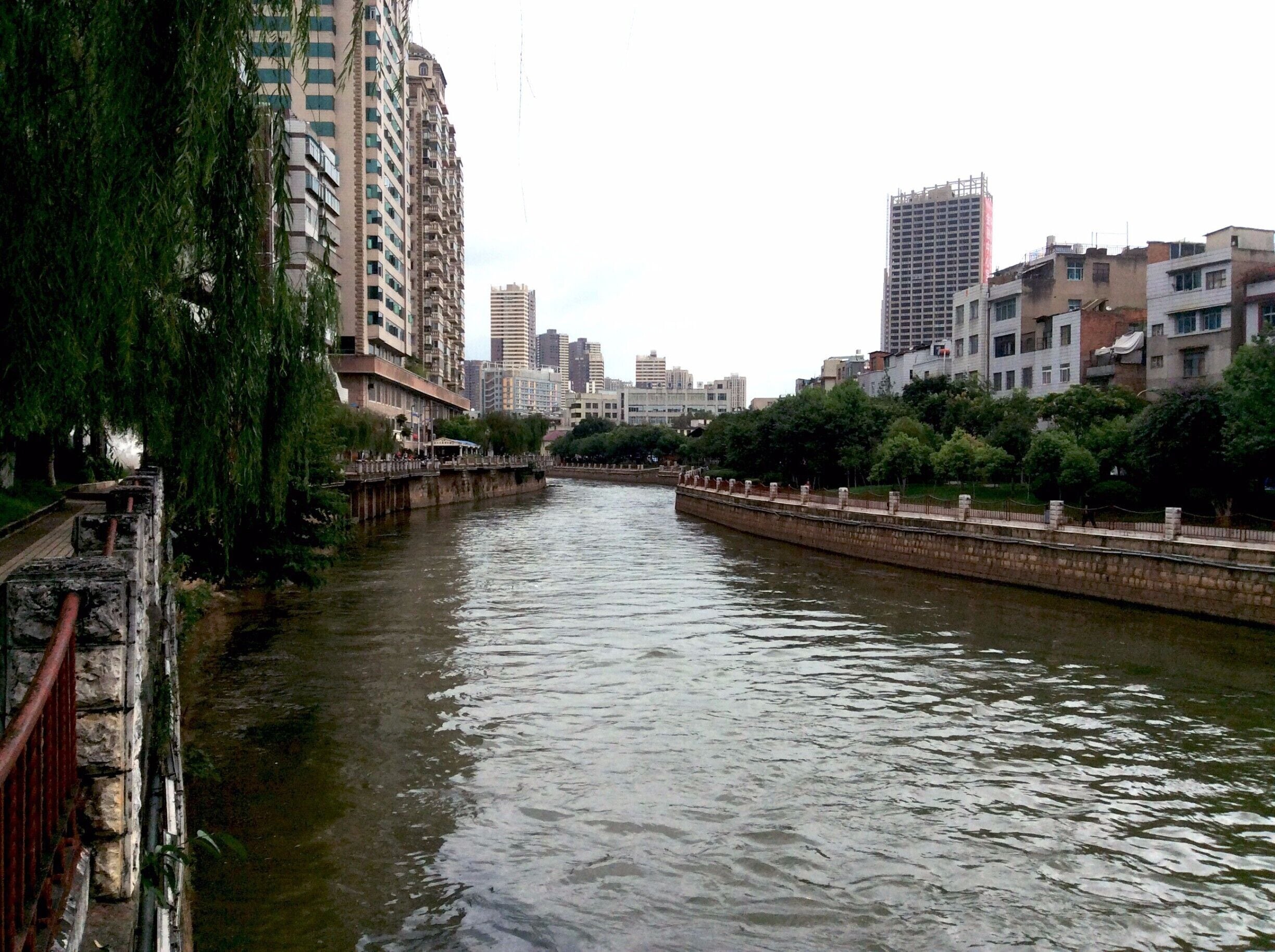 Kunming, like most large Chinese cities, can be wearing upon the senses.  So, if you should find yourself here in what is a very special area, and you are looking for a nice stroll, I strongly suggest going along 盘龙江（Panlong Jiang).  There are green spaces and ample walking paths that allow one to walk from the North edge of Kunming, to the train station in the south.  You can probably go further, but I haven't gone that far yet.  

Not only is it much quieter and beautiful than the crowded streets, but like most cities, there is a different culture that exists here.  I recently took a walk and captured some interesting pictures which I will post in the coming days.