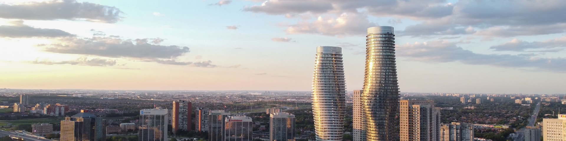 Aerial view of downtown Mississauga, Ontario, Canada landmark Absolute buildings condominiums. Looking east down Burnhamthorpe Road towards Hurontario Street. Shot on a beautiful summer afternoon.