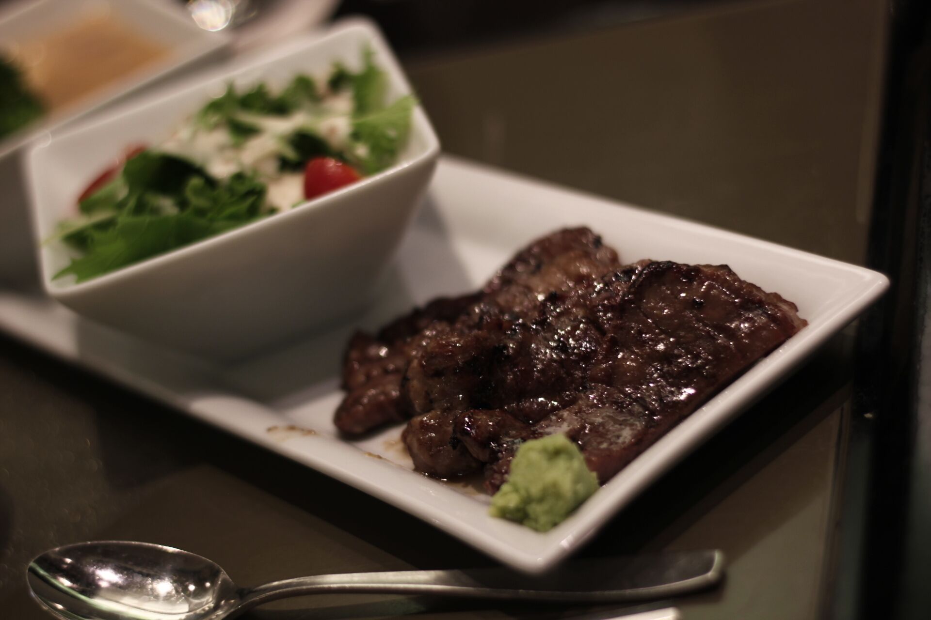 #TroveOn Sendai's beef cow tongue a.k.a. gyutan/牛タン at Aobatei 青葉亭 #FoodieFinds

Tasty, charcoal meat that was not surprisingly chewy as I'd expect. It's like regular meat. I got the gyutan set menu that comes with salad and soup.

Located at S-pal building on the first floor. Spotted this restaurant while wandering around Sendai Station. 3.51 at tabelog though IJS. Legit.

When I was traveling around up north, I was collecting shinkansen badges because JR East had a promo to give away badges when you visit specific stations, Sendai Station is one of them. I had a JR Pass so I said, why not? The train ride took about three hours back and forth. Shinkansen took a lot of my time in Japan. I got there around afternoon already so I had to account the other three hours going back to Annaka at night. I just hang around Sendai Station and like any Japanese stations, wandered around looking at omiyage stuffs and found myself a restaurant that serves gyutan.
