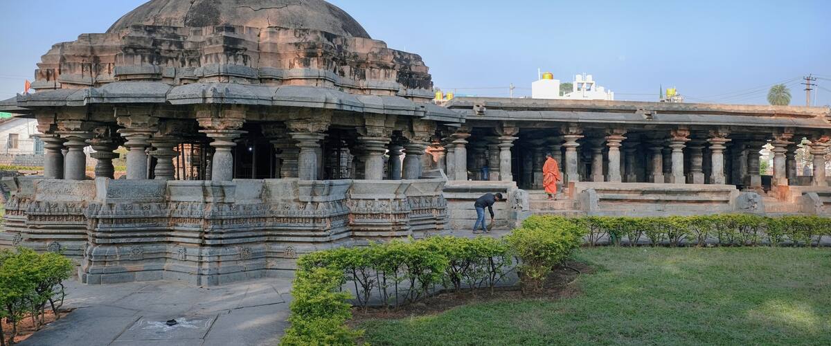 A large stone temple with a dome and intricate carvings.