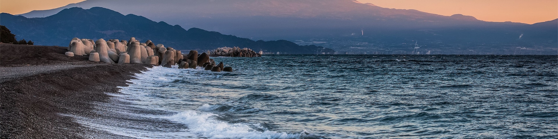 Mt. Fuji and sea beach in winter morning. Seen from Miho no Matsubara , a scenic area. The Miho Peninsula in Shimizu Ward of Shizuoka City, Japan.