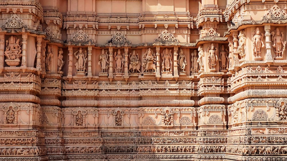 Beautiful carving sculptures of Hindu deities and animals on Shree Khondaldham Temple, Kagvad, Rajkot, Gujarat, India.