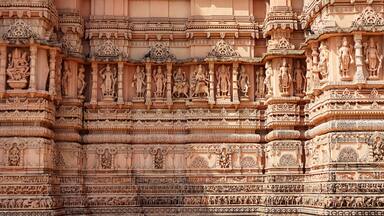 Beautiful carving sculptures of Hindu deities and animals on Shree Khondaldham Temple, Kagvad, Rajkot, Gujarat, India.