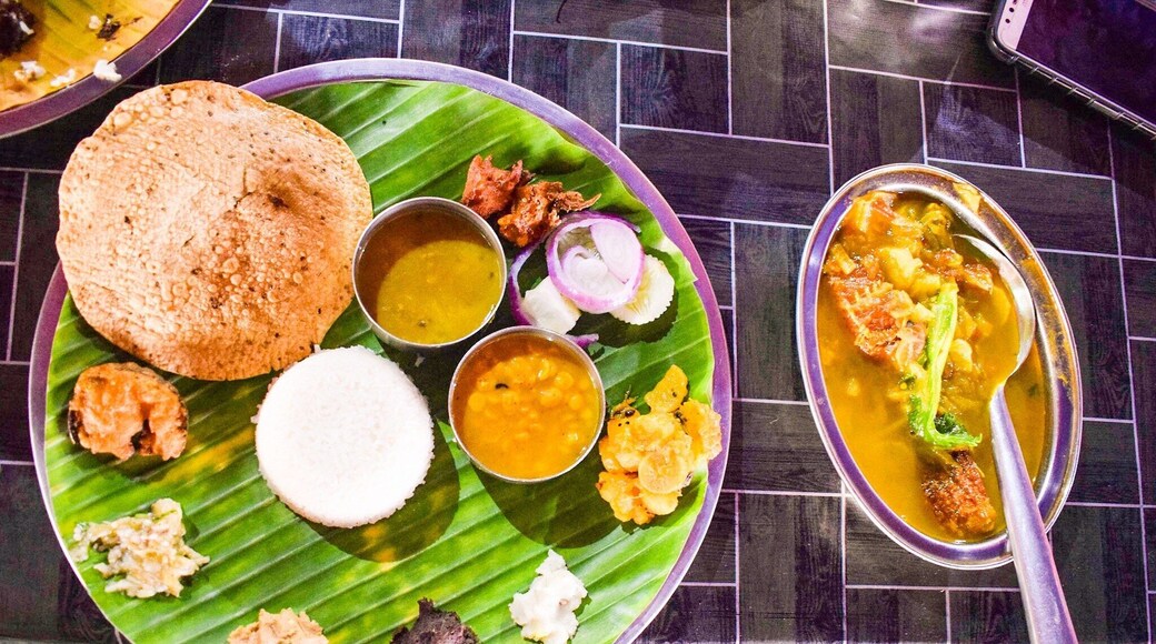 A sumptuous Assamese Thali served on Brass metal plate and easily feed a vegan sans the fish curry in accompanying bowl. Priced at inr 200 I believe.