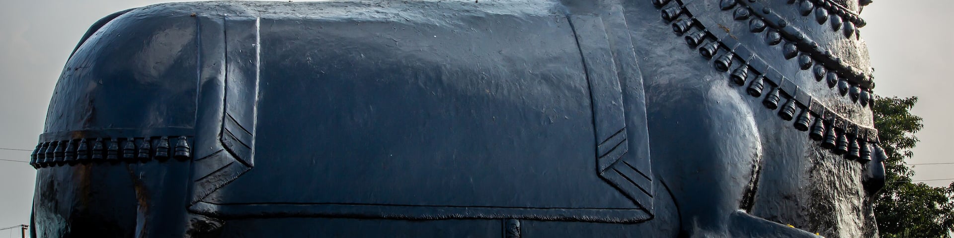 View of giant Nandhi statue in a temple, Kolar, Karnataka, India. Nandi is the gate-guardian deity of Kailasa, the abode of Lord Shiva