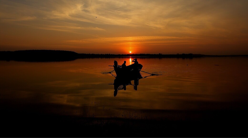 As I get mesmerised by the awesome sunset scene. It made me wonder if the fishermen couples in this scene are even thinking about the profoundness of the moment. In all probability this is a daily scene for them and maybe it just gets drowned in their tired mind and body after many hours of hard work... Are we too being observed by someone else in a similar profound scene with the observers wondering if we appreciate being part of the scene??