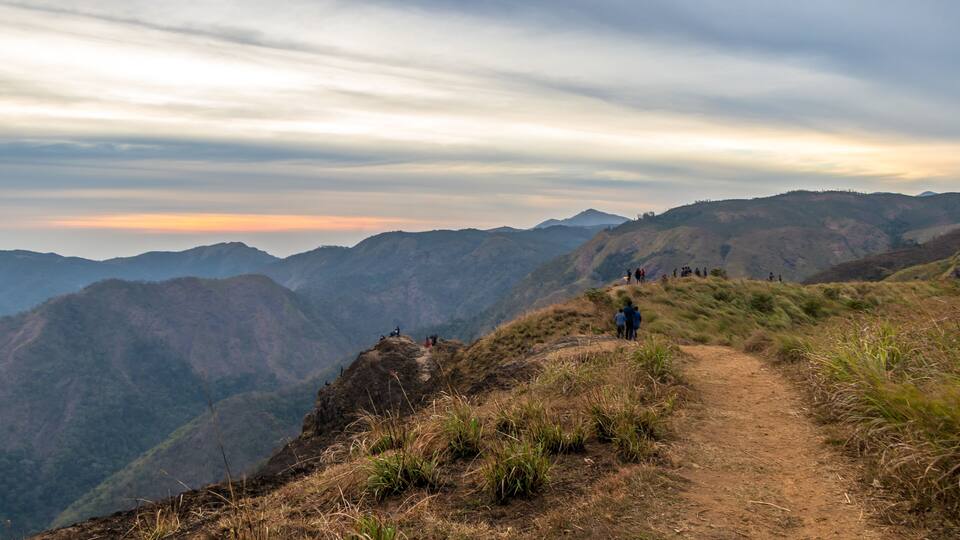 A mountain path with hikers.