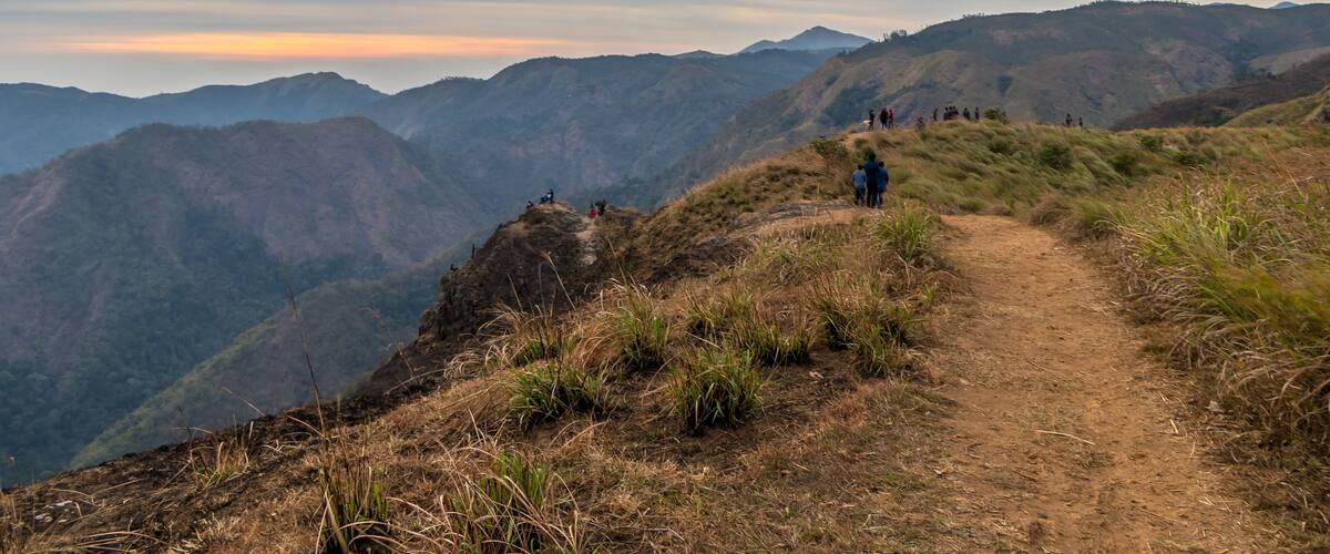 A mountain path with hikers.