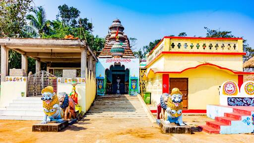 Colorful Hindu Temple of Sri Sri Jagannath at Konark, Odisha, India, with beautifully carved stone lions guarding the entrance.