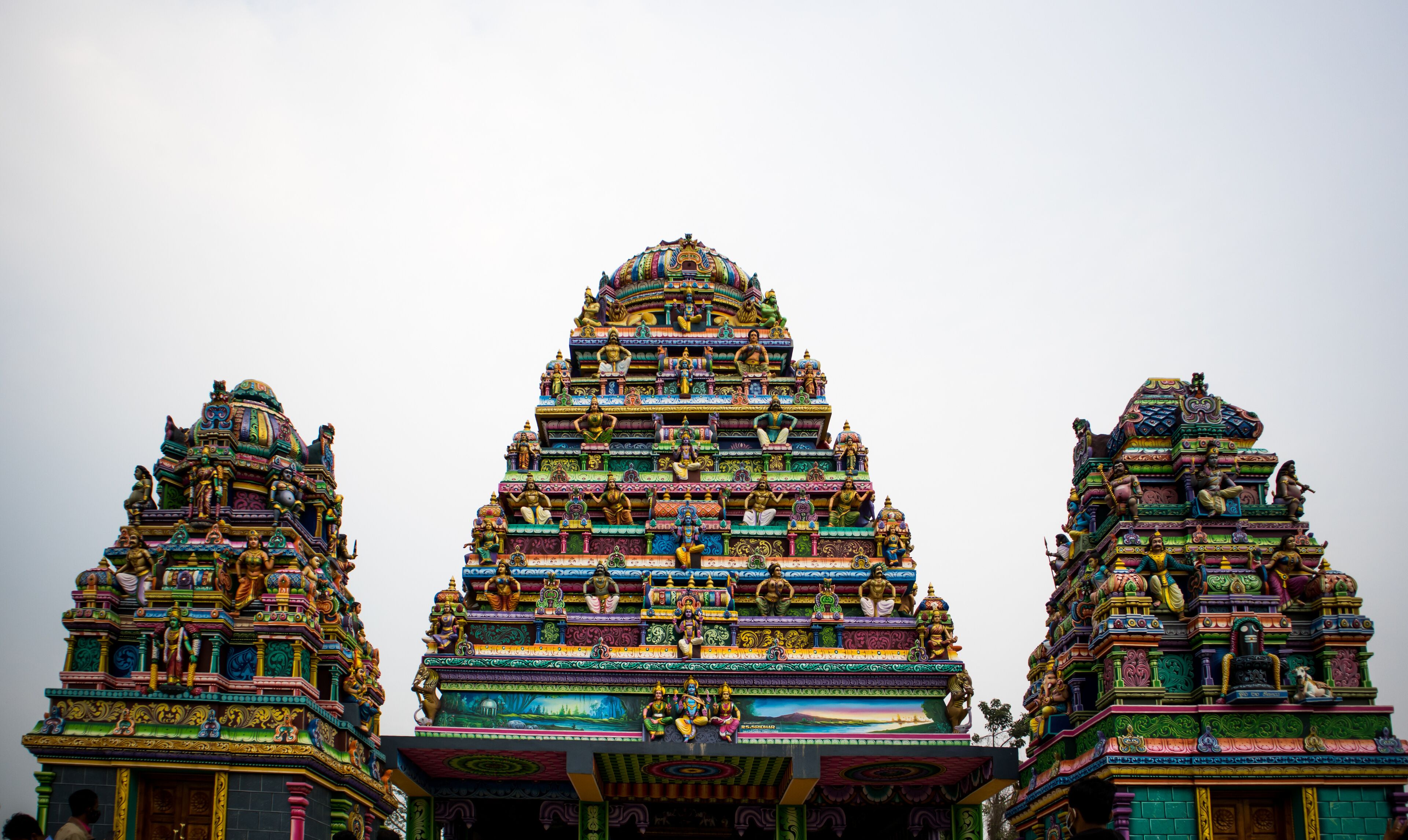 A multi-tiered temple with intricate carvings and statues.