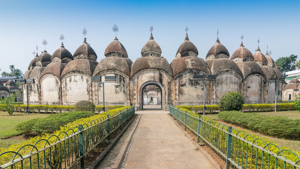 A historic building with multiple domes and a central archway.