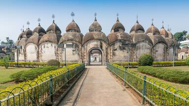 A historic building with multiple domes and a central archway.