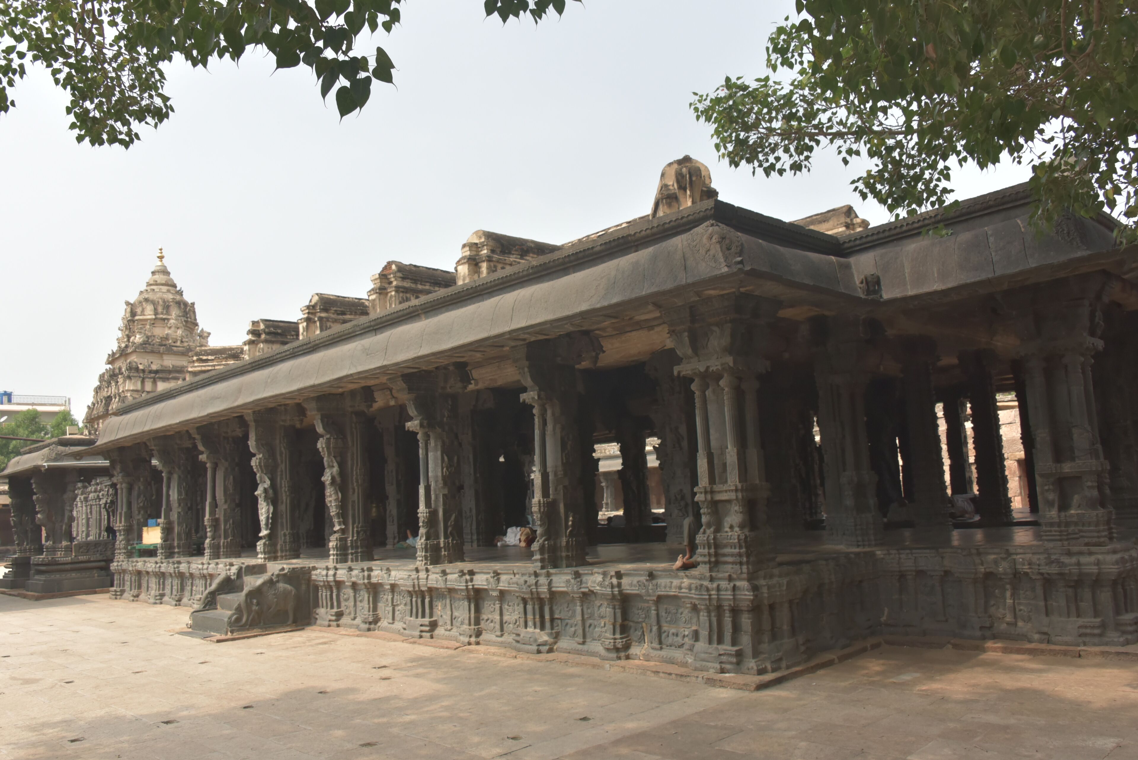 An ancient temple with intricate carvings and a large central dome.