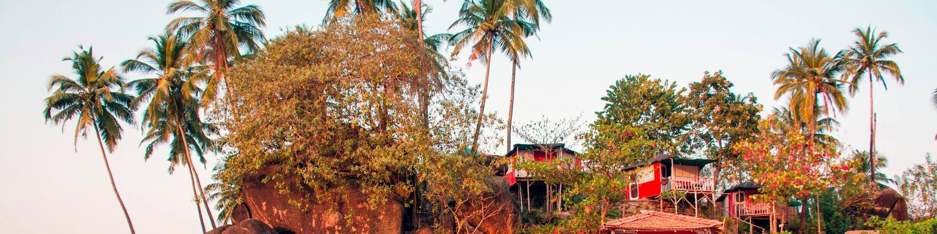 Beach huts, Colomb Beach, near Palolem Beach, Goa. Most of the accommodations at Palolem are cabanas such as these, although not all of them are built onto the rocks like these. Nearly all of them are built anew at the beginning of the tourist season and dismantled in April or May before the summer monsoon hits. The torrential rain and high water of these storms would likely tear them apart otherwise, and Goa's government wants to keep the hotels here small-scale and simple. They're also generally very reasonably priced.