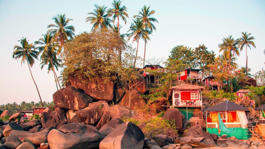 Beach huts, Colomb Beach, near Palolem Beach, Goa. Most of the accommodations at Palolem are cabanas such as these, although not all of them are built onto the rocks like these. Nearly all of them are built anew at the beginning of the tourist season and dismantled in April or May before the summer monsoon hits. The torrential rain and high water of these storms would likely tear them apart otherwise, and Goa's government wants to keep the hotels here small-scale and simple. They're also generally very reasonably priced.