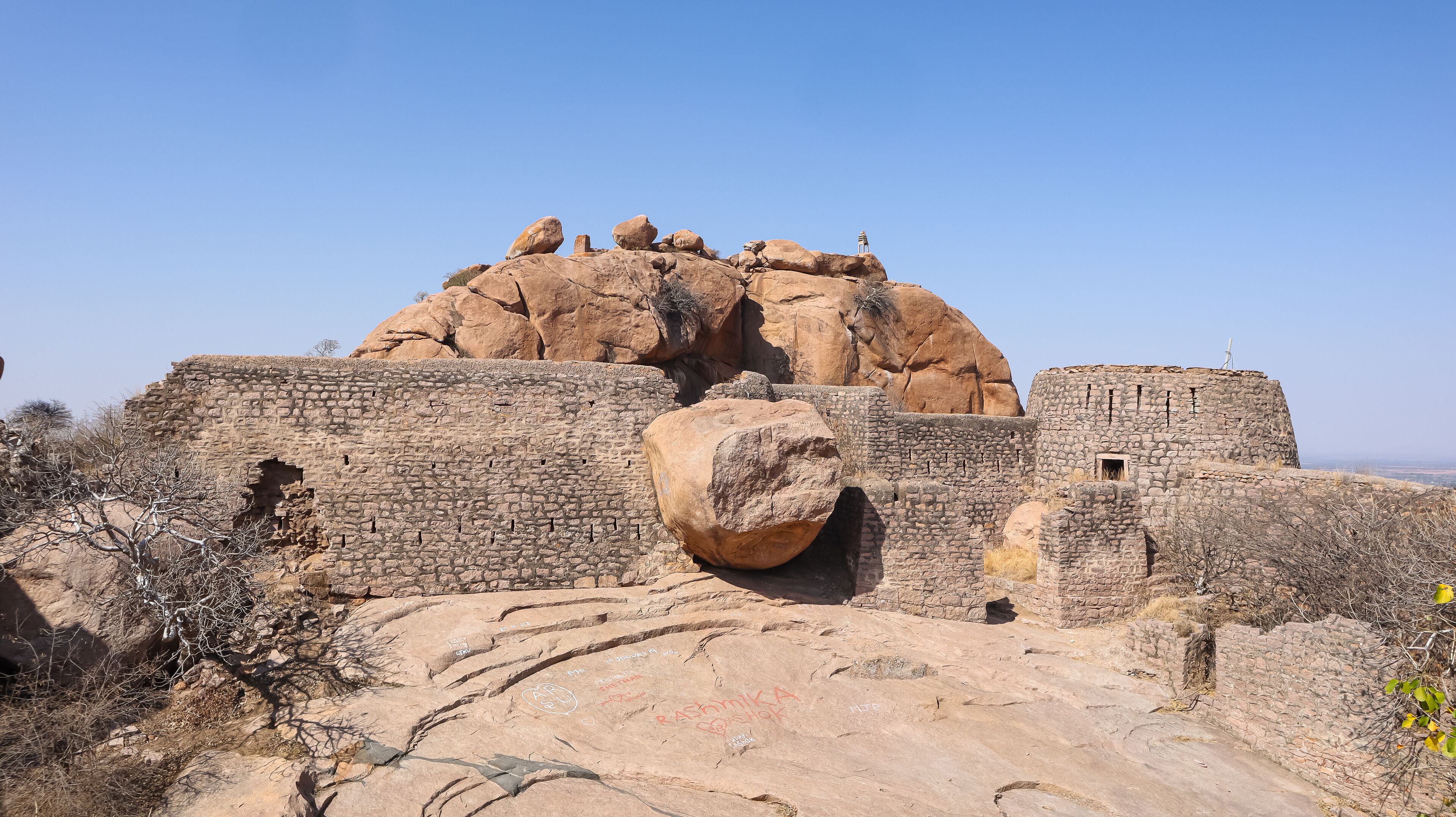 A historical fort with large rock formations and stone walls.