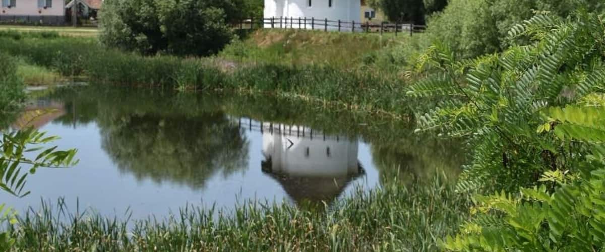 The Calvinist church of Csengersima in #Romanesque style was built in the 13th century. The pond is a blind channel of the river #Szamos.