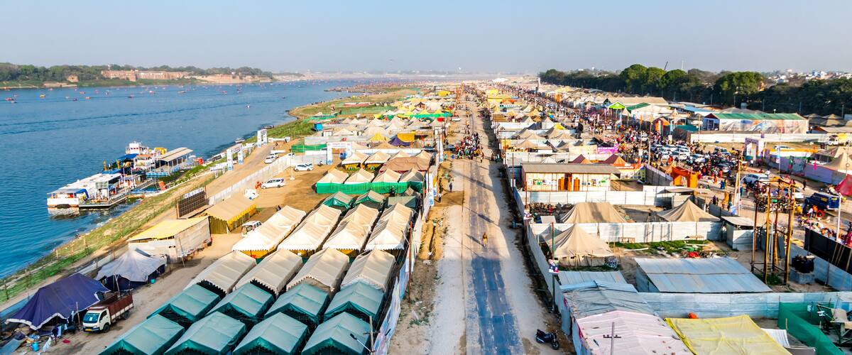 Aerial view of tent city and Triveni Sangam at The Maha Kumbh Mela in Prayagraj, Uttar Pradesh, India. The Mahakumbh Mela is a Hindu festival that happens every 12 years.