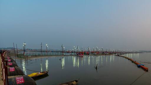 Kumbha Mela, Allahabad, Uttar Pradesh, India; 17-Feb-2019; lights on the river banks, sunset at Sangam, river Ganges
