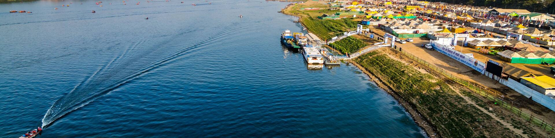 Aerial view of tent city and Triveni Sangam at The Maha Kumbh Mela in Prayagraj, Uttar Pradesh, India. The Mahakumbh Mela is a Hindu festival that happens every 12 years.