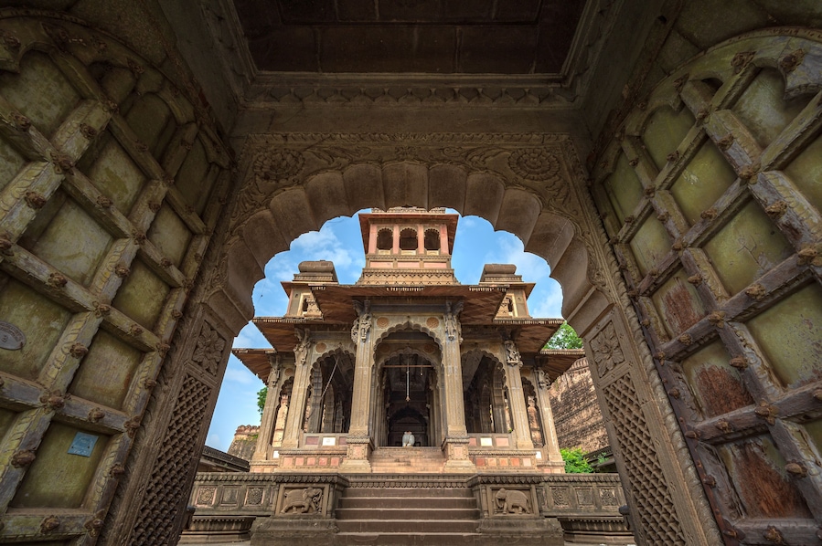Maheshwar, Madhya Pradesh, India - August 25, 2023: Exterior shots of the scenic tourist landmark Maheshwar fort and temple. This monument is on the banks of the Narmada River.