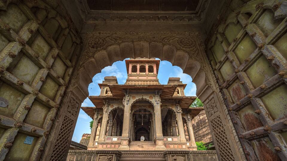Maheshwar, Madhya Pradesh, India - August 25, 2023: Exterior shots of the scenic tourist landmark Maheshwar fort and temple. This monument is on the banks of the Narmada River.