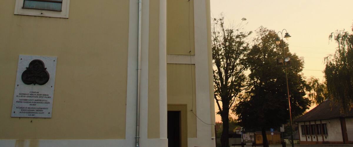 A church with a bell tower and a clock.