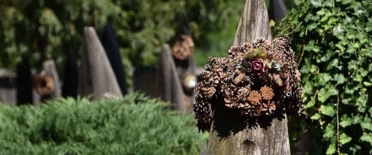 The unique cemetery of Szatmárcseke with over 600 boat-shaped wooden headstones. It's a functioning cemetery with several recent graves.