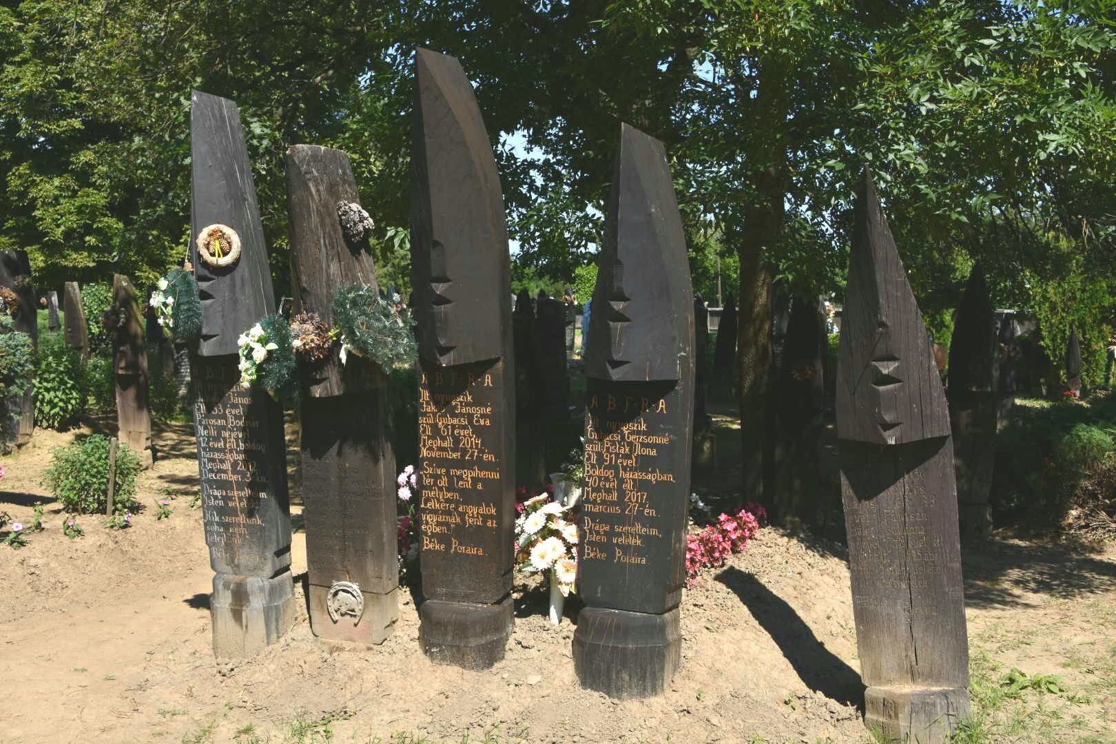 The unique cemetery of Szatmárcseke with over 600 boat-shaped wooden headstones. It's a functioning cemetery with several recent graves.