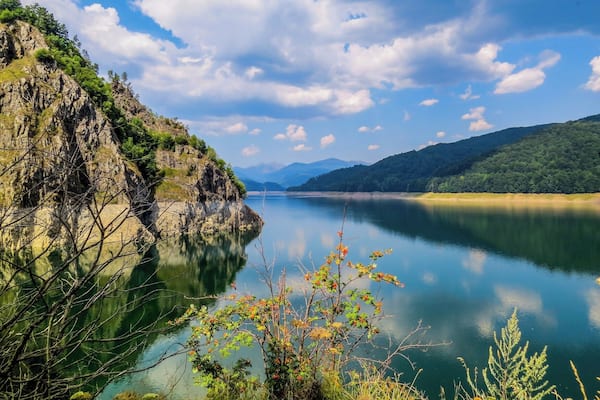 Beautiful artificial Lake Vidraru in Romenia. It was created in 1965 by the construction of the Vidraru Dam on the Arges River. Check out the natural mirror effect.
