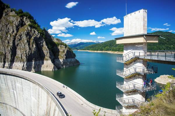 A dam with a staircase and a road leading to it.