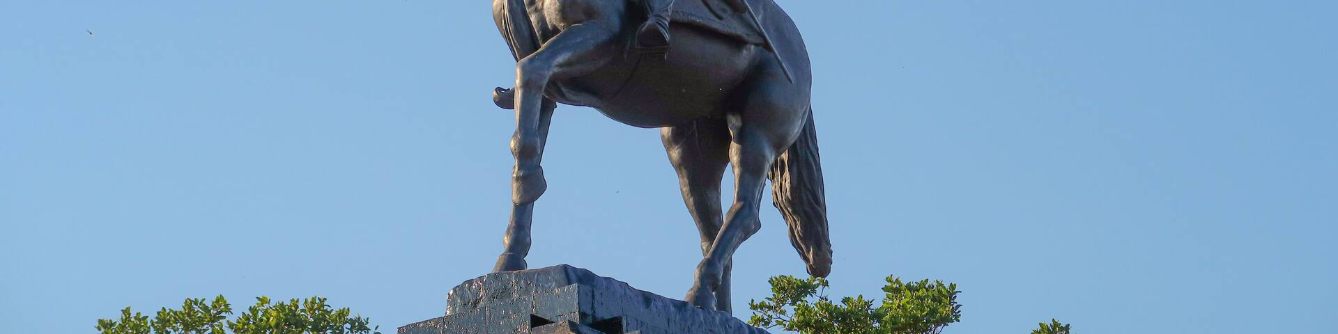 Statue of Chhatrapati Shivaji Maharaj on horseback riding a horse with raised sword Pratapgad, Maharashtra, India
