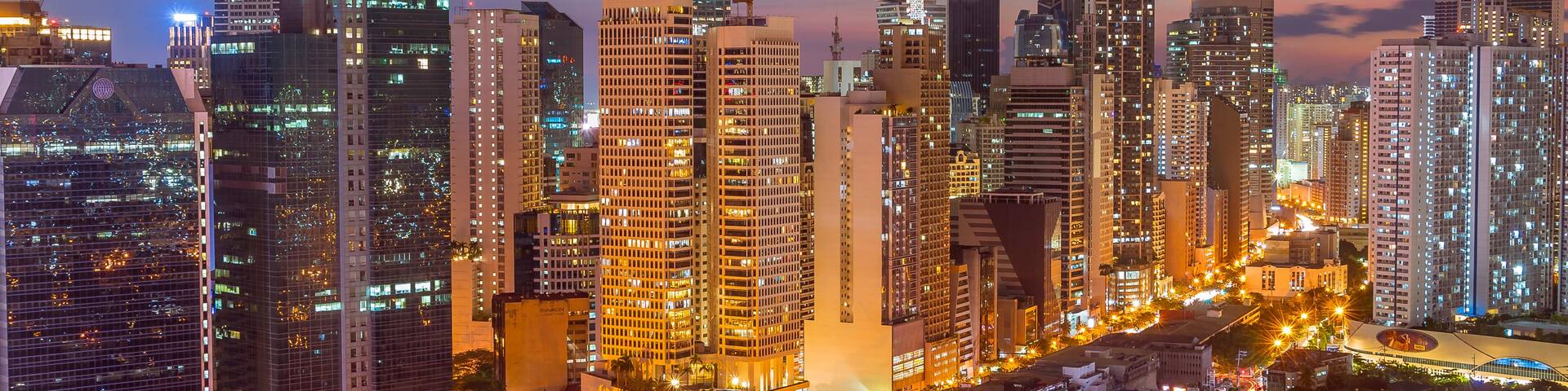 Makati, Metro Manila, Philippines - Early evening shot of Makati skyline. View of Salcedo District and Bel Air Village.