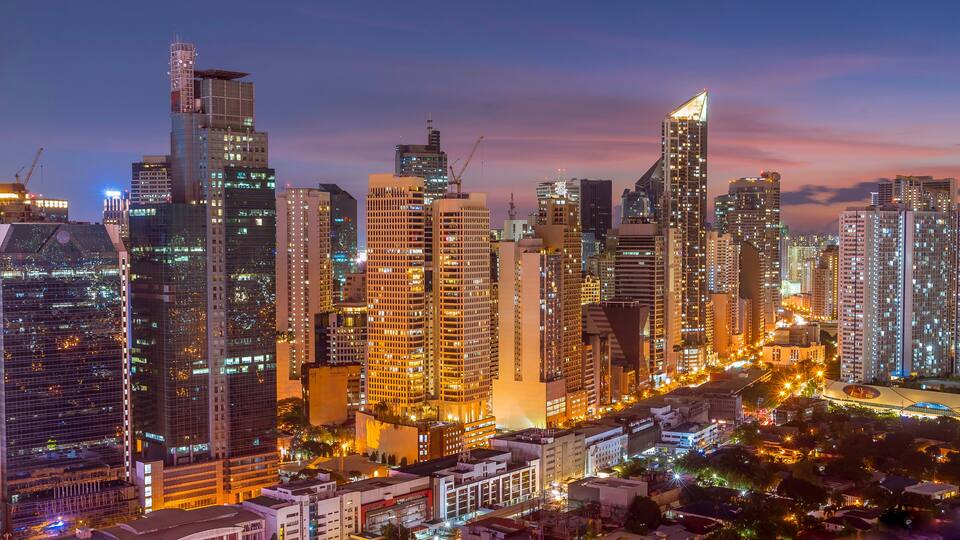 Makati, Metro Manila, Philippines - Early evening shot of Makati skyline. View of Salcedo District and Bel Air Village.