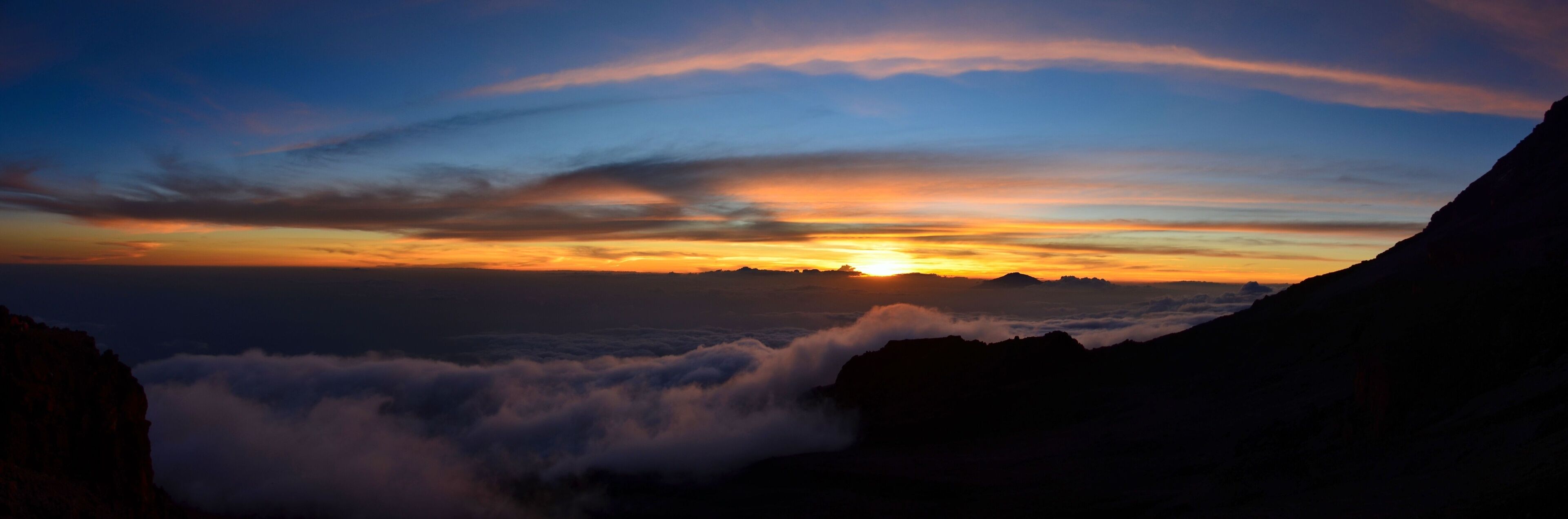 A mountain range with a sunset.