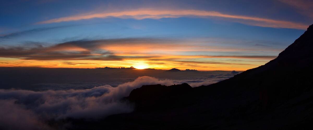 A mountain range with a sunset.