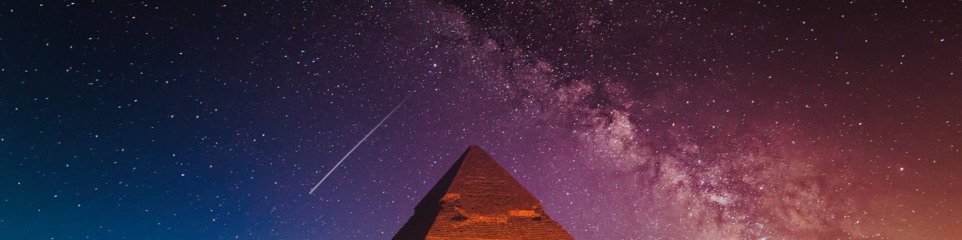 Keops Pyramid from Giza at fantastic purple night with the Milky Way in the sky