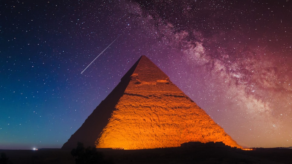 Keops Pyramid from Giza at fantastic purple night with the Milky Way in the sky