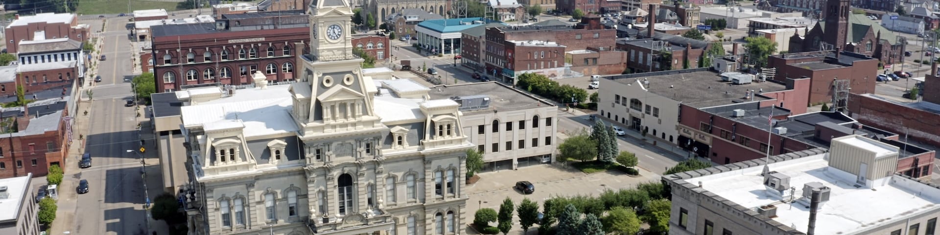 An aerial establishing shot of the Muskingum County Courthouse and clock tower in downtown Zanesville, Ohio.