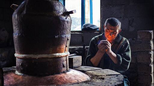 While on assignment for WWF-Romania, we visited some villages in the north of Romania, in Maramures. This man was making palinca (an extremely hot fruit brandy). While he was explaining the process, he decided all that talk deserved a cigarette.
www.doruoprisan.com