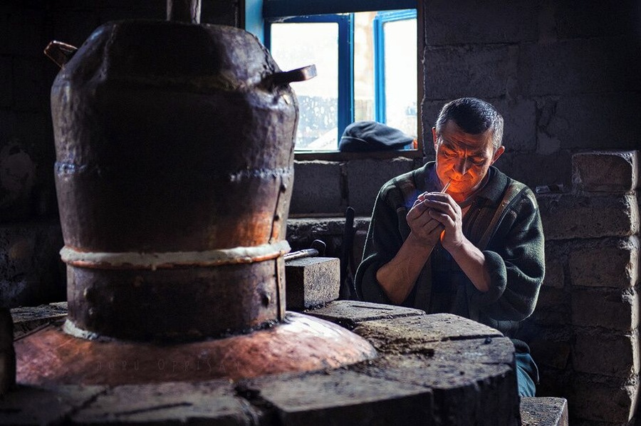 While on assignment for WWF-Romania, we visited some villages in the north of Romania, in Maramures. This man was making palinca (an extremely hot fruit brandy). While he was explaining the process, he decided all that talk deserved a cigarette.
www.doruoprisan.com