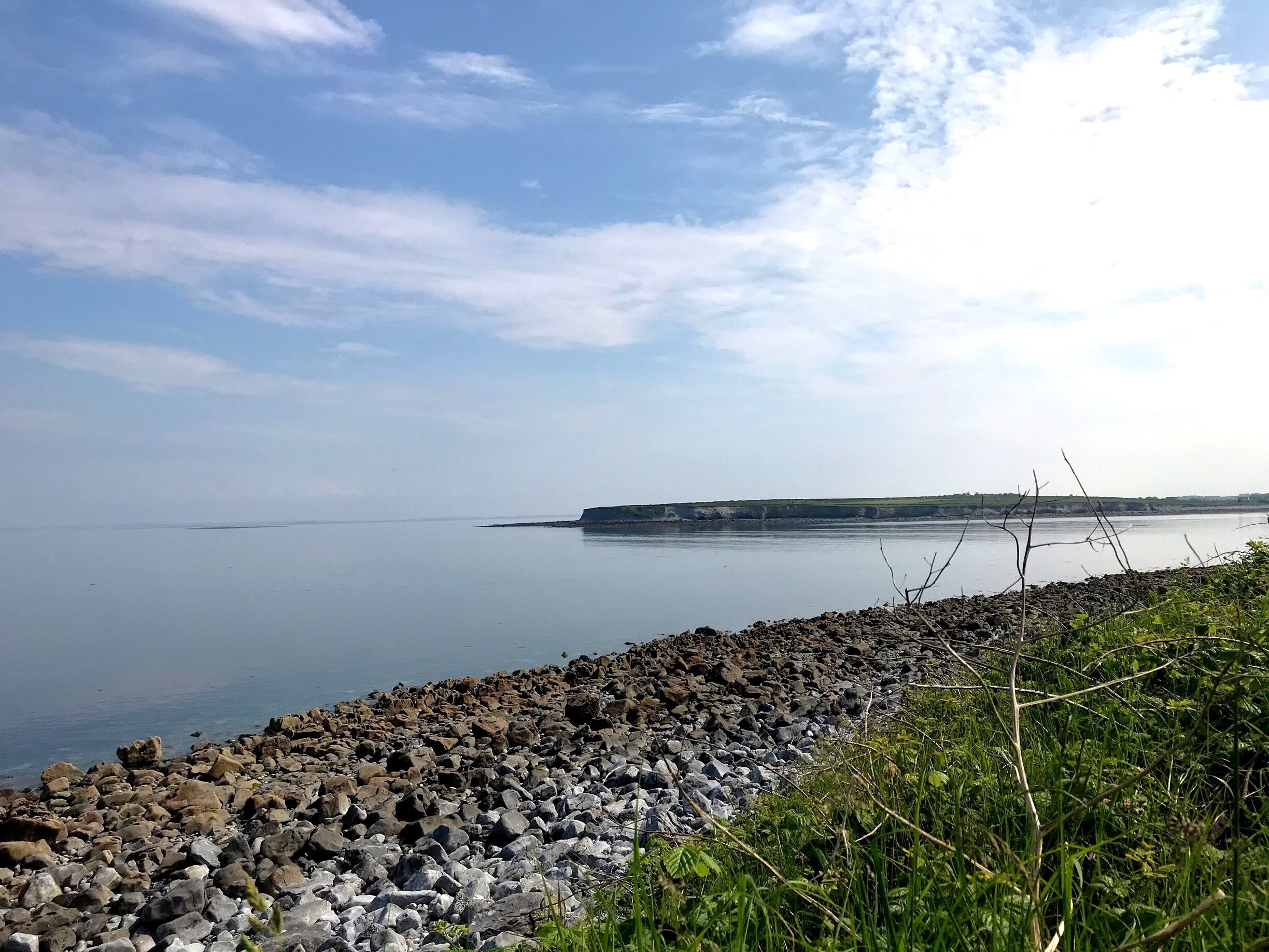 Such a tranquil spot... we were swimming here in the evening and it was just perfect. You can walk around the shore to an ice cream cafe in one direction and a pub that does sea food in the other. Heaven.