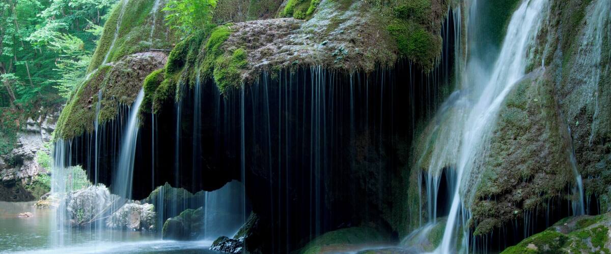 'Located on the 45th parallel north, Bigăr Waterfall is extremely delicate and unusual, with a water curtain falling down some lush green vegetation, and is set in a very remote, peaceful, and picturesque area of Romania, where the rolling hills create a real fascination for the authenticity of our nation’s past. On our way back to the main road, we made another detour to see the water mills at Eftimie Murgu, some of them still functional, and smell the freshly ground cereal grains.'
#waterlust