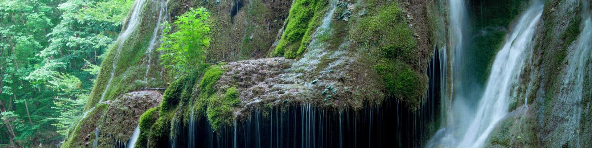 'Located on the 45th parallel north, Bigăr Waterfall is extremely delicate and unusual, with a water curtain falling down some lush green vegetation, and is set in a very remote, peaceful, and picturesque area of Romania, where the rolling hills create a real fascination for the authenticity of our nation’s past. On our way back to the main road, we made another detour to see the water mills at Eftimie Murgu, some of them still functional, and smell the freshly ground cereal grains.'
#waterlust