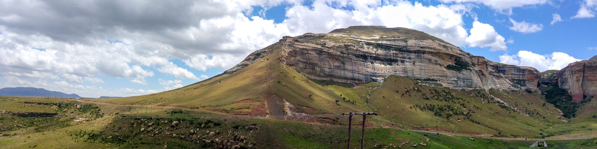 Fluffy clouds over rock formations in the Golden Gate Highlands National Park, Clarens, Free State, South Africa