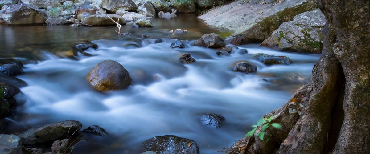 Beautiful landscape photo with waterfall in the forest and a cool breeze