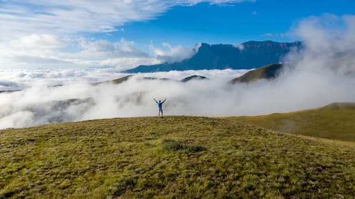 Aerial View of mountains in the clouds in, Maluti A Phofung NU, Free, South Africa.