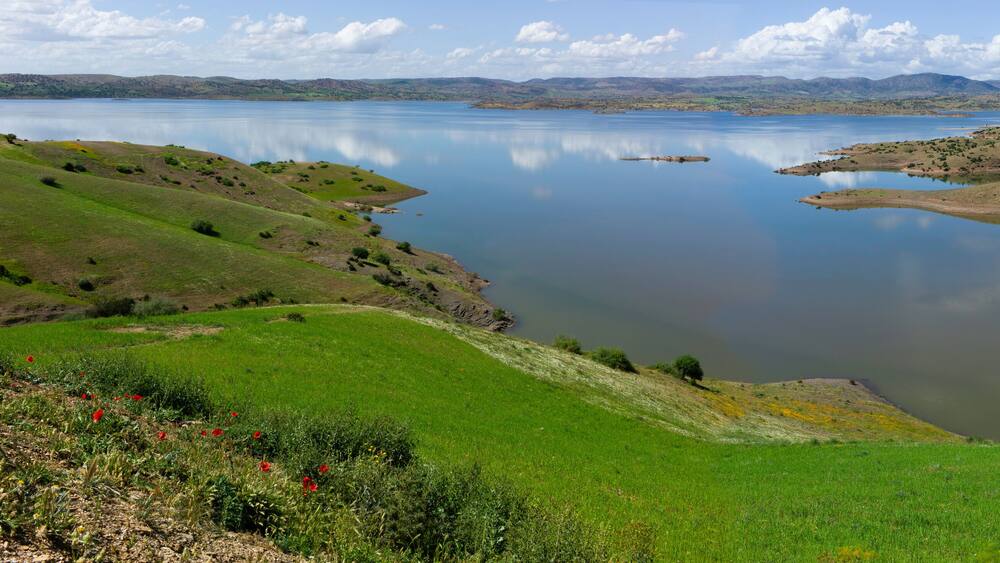 Panoramic view of the artificial lake of Bin el Oiudane in High Atlas in Morocco with blue sky. Widescreen photo