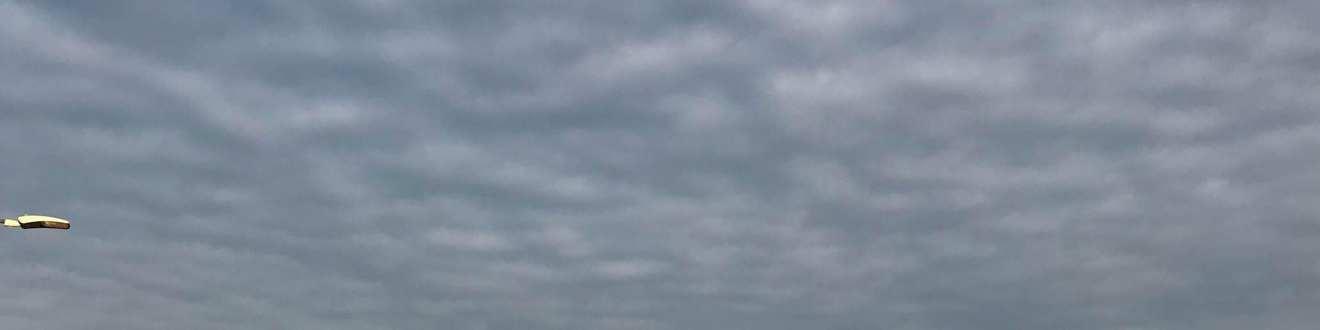 When go up to my office I don't understand why it's so clear if the sky are cloudy, but the morning sun had slipped under the clouds.