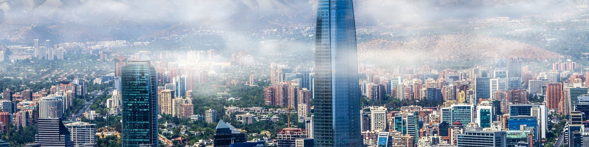 Aerial view on skyscrapers of Financial District of Santiago, capital of Chile under early morning fog